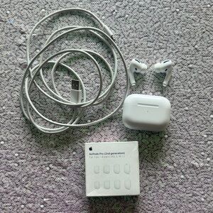 Apple AirPods Pro 1st Gen with charging cable and replacement tips
